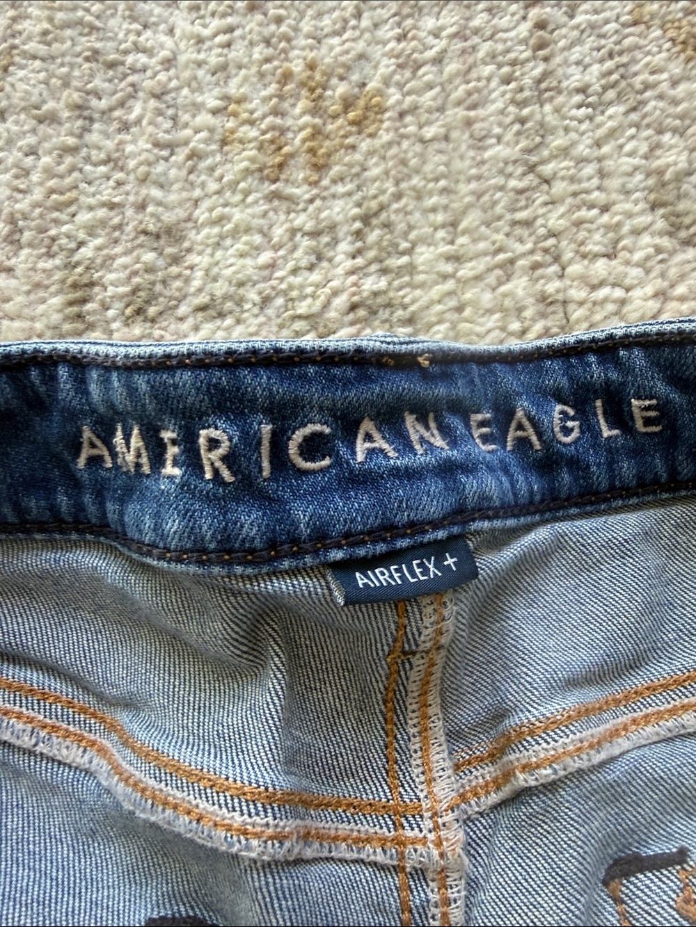 American Eagle Blue Denim Jeans with Tan Stitching
